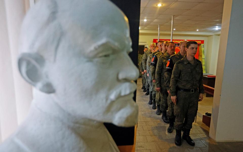 Service members of the self-proclaimed Luhansk People's Republic (LPR) line up to vote during a referendum on joining LPR to Russia at a military unit in Luhansk - ALEXANDER ERMOCHENKO /REUTERS