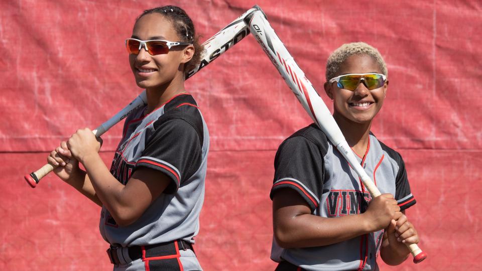 Morgan Harrell-Alvarez, left, and her fraternal twin sister Megan Harrell-Alvarez, right, are members of Vineland High School's varsity softball team.  