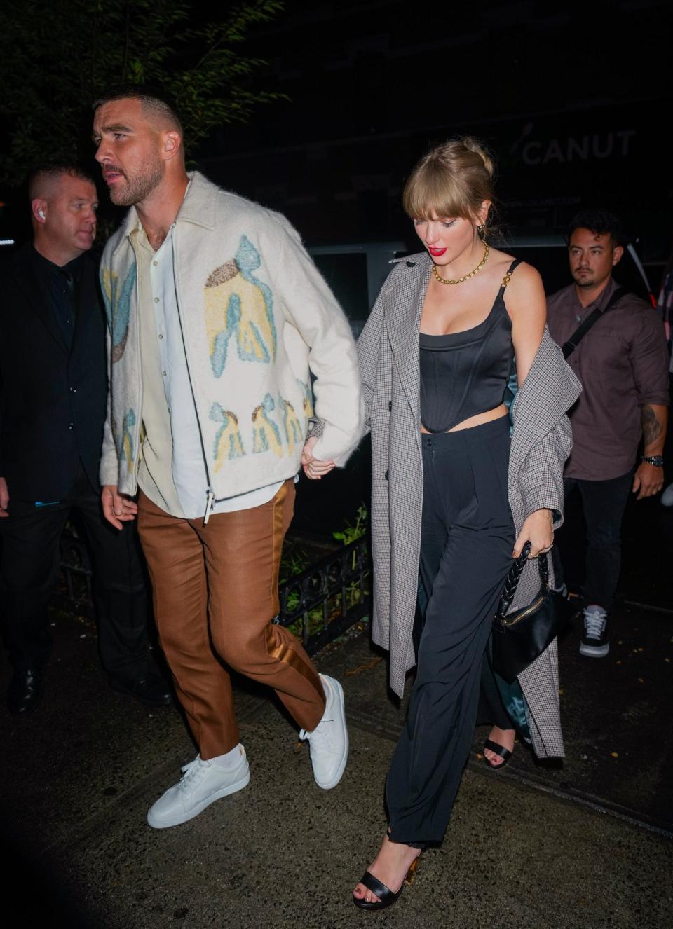 Travis Kelce and Taylor Swift leave a "Saturday Night Live" after party in New York City.
