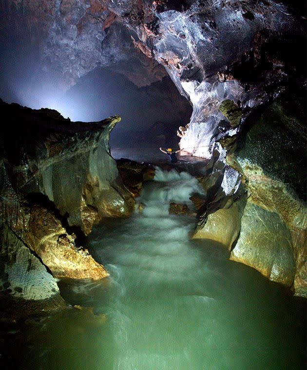 It takes a half-day trek through jungle and deep rivers just to get to the entrance. Photo: Getty images