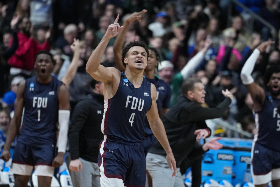 Fairleigh Dickinson guard Grant Singleton (4) celebrates after a basket against Purdue in the second half of a first-round college basketball game in the men's NCAA Tournament in Columbus, Ohio, Friday, March 17, 2023. (AP Photo/Michael Conroy)