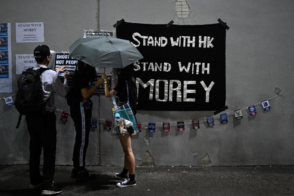 Protesters display posters at the Southorn Playground in Hong Kong on October 15, 2019, during a rally in support of NBA basketball Rockets general manager Daryl Morey and against comments made by Lakers superstar LeBron James. - US basketball superstar LeBron James on October 14, 2019, has sharply criticised a Houston Rockets executive for angering China with a tweet supporting protesters in Hong Kong, saying the executive was "misinformed" and should have kept his mouth shut. (Photo by Anthony WALLACE / AFP) (Photo by ANTHONY WALLACE/AFP via Getty Images)