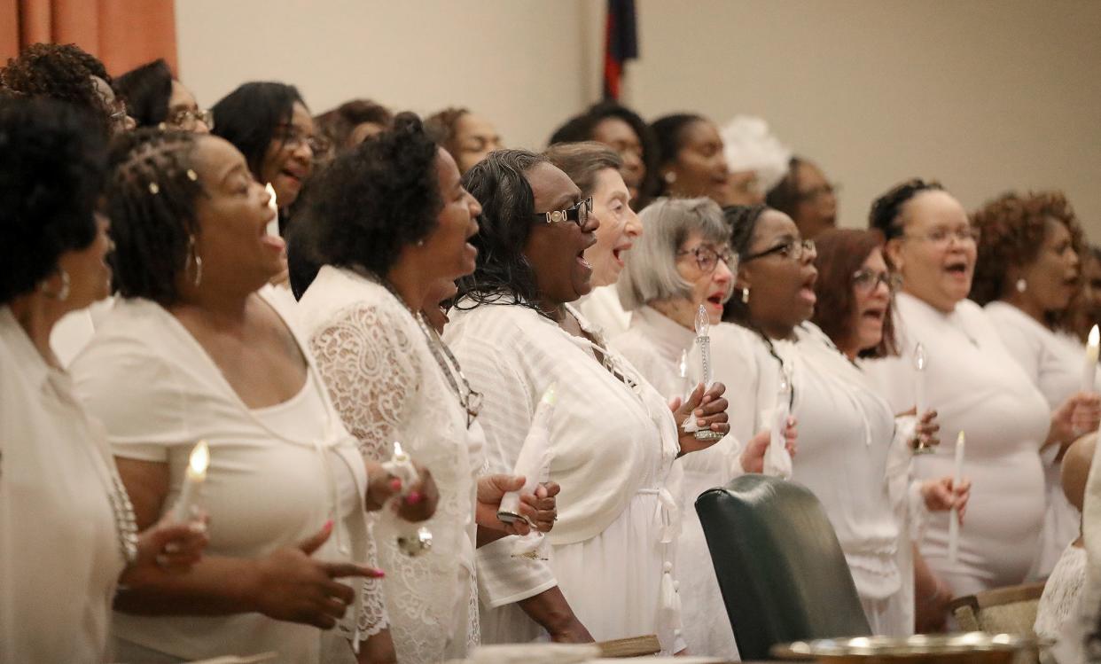 The 100 Women in White sing worship music on Sunday, March 17, 2024, at Second Baptist Church in Alliance during the group's 26th faith concert event.