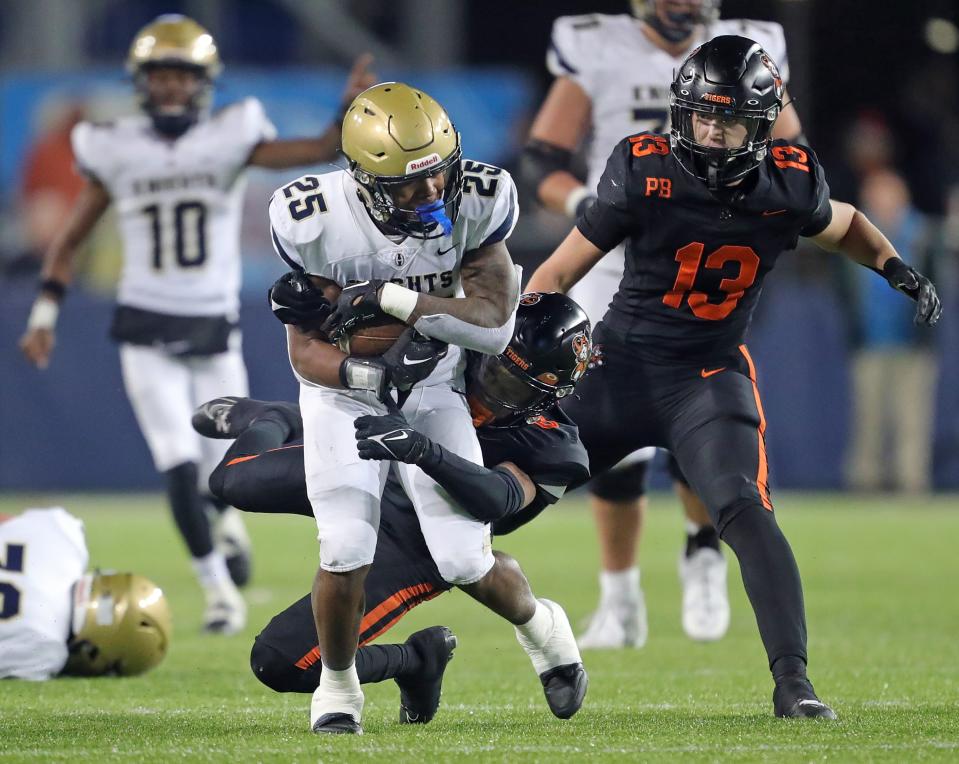 Hoban running back Caleb Jones rushes for a first down against Massillon during the second half.