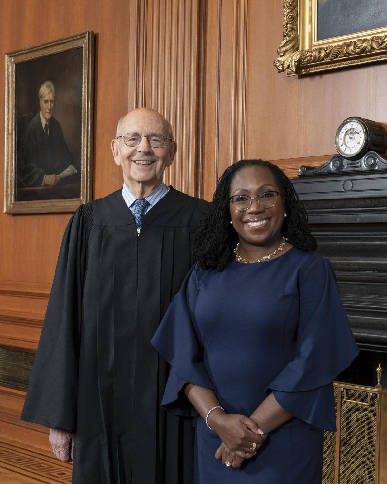 In this image provided by the Collection of the Supreme Court of the United States, retired Supreme Court Justice Stephen Breyer poses for a photo with Supreme Court Justice Ketanji Brown Jackson at the Supreme Court in Washington, Thursday, June 30, 2022. 