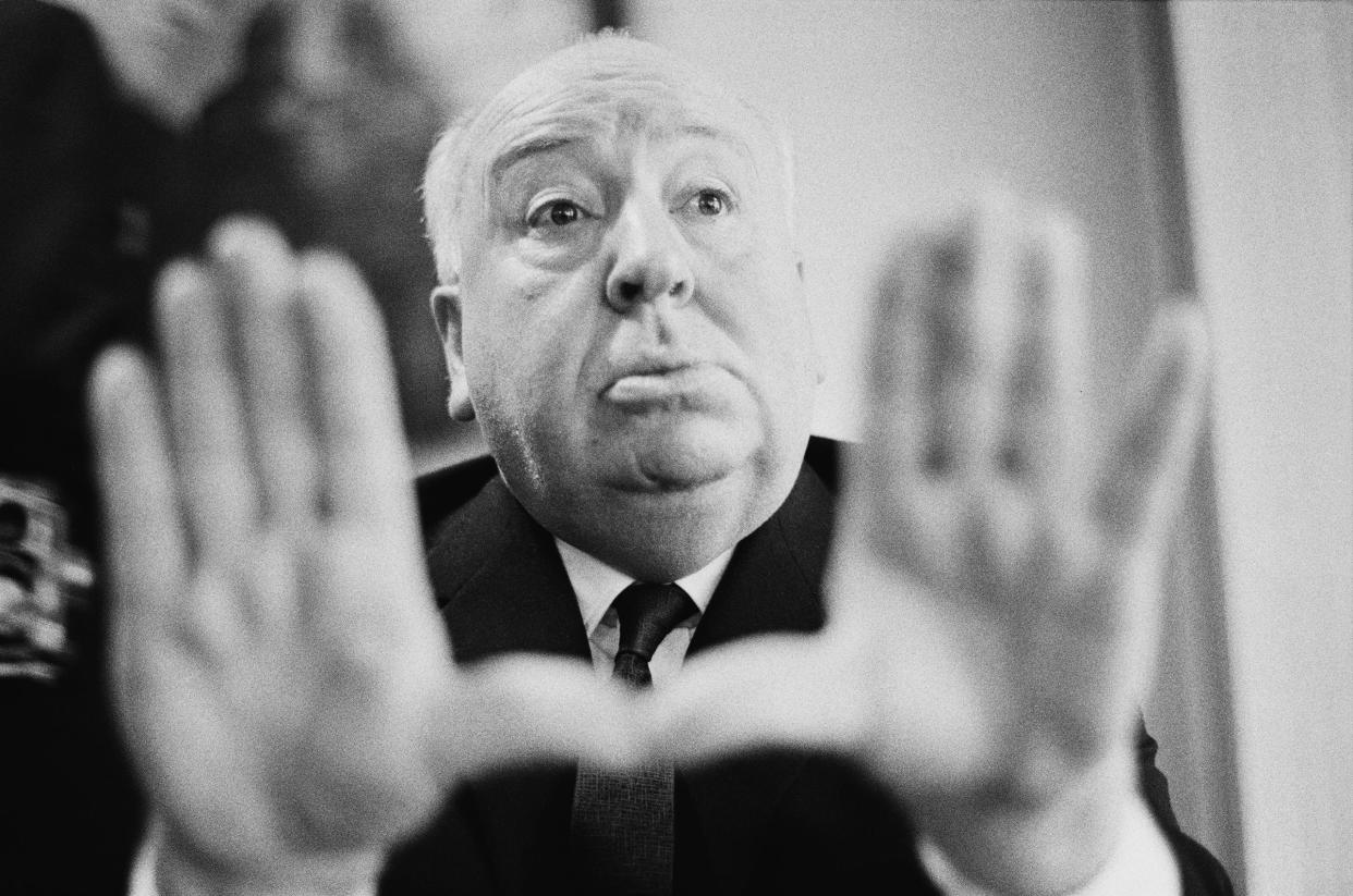 Alfred Hitchcock frames a shot with his hands, 1964<span class="copyright">Tony Evans—Timelapse Library Ltd./Getty Images</span>