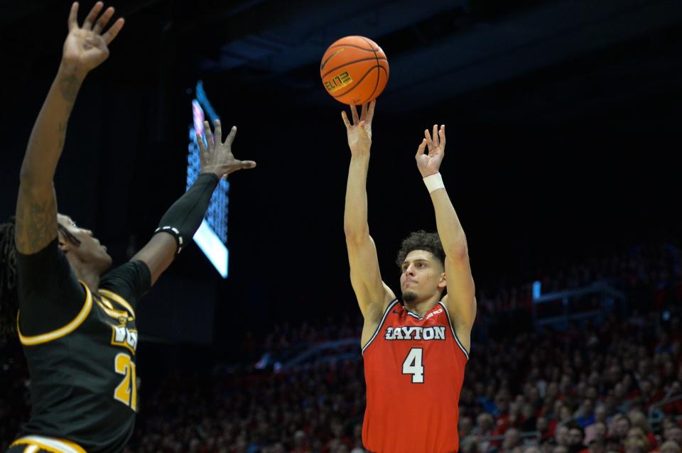 Mar 8, 2024; Dayton, Ohio, USA; Dayton Flyers guard Koby Brea (4) shoots the ball against Virginia Commonwealth Rams forward Christian Fermin (21) during the second half of the game at University of Dayton Arena. Mandatory Credit: Matt Lunsford-USA TODAY Sports