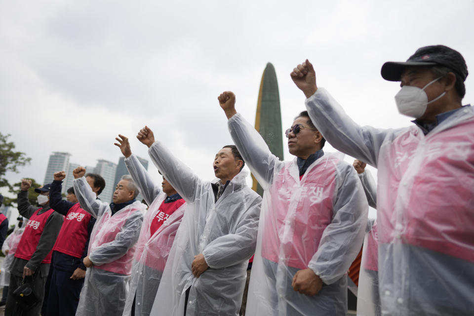 Members of the association of dog farmers, shout slogans during a rally in Seoul, South Korea, Tuesday, April 25, 2023. Dozens of dog farmers in South Korea rallied Tuesday to criticize the country’s first lady over her reported comments that support a possible ban on dog meat consumption. (AP Photo/Lee Jin-man)