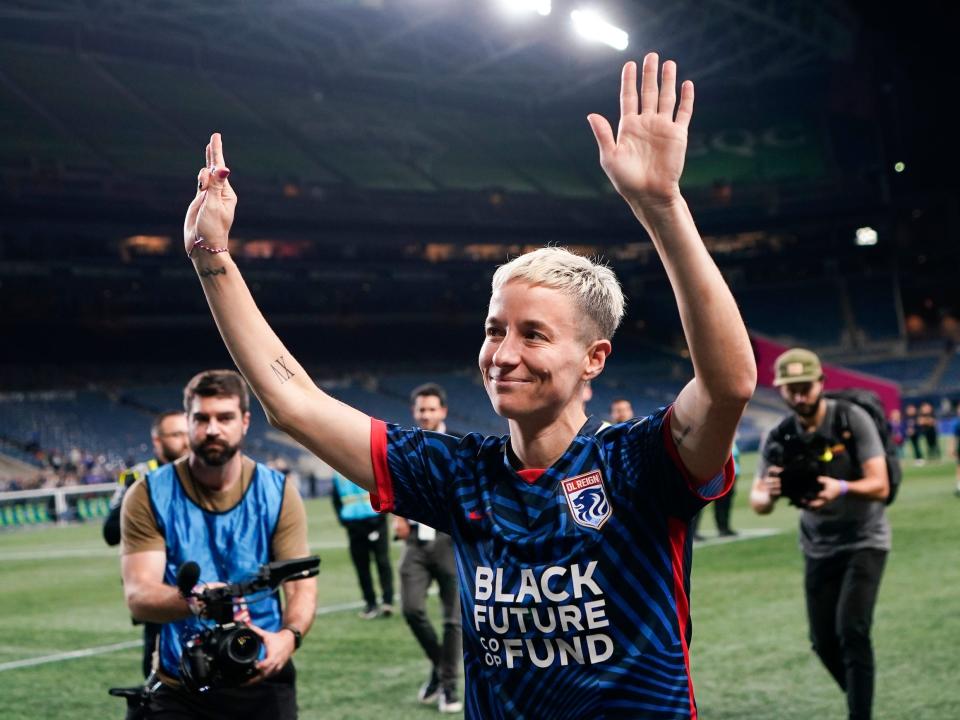 Megan Rapinoe waves goodbye to the crowd at Seattle's Lumen Field after her final regular-season match for OL Reign.