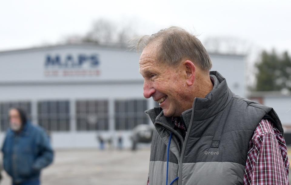 Volunteer Ray Weber, a retired one-star general talks Saturday while watching as a C-130H Hercules Air Force combat cargo aircraft with the guidance from Mansfield Ohio Air National Guard 179th Airlift Wing makes its way to MAPS Air Museum in Green.