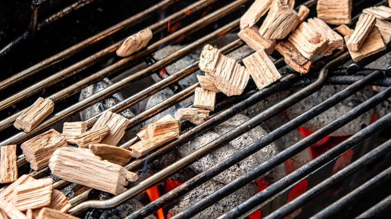 Wood chips on gas grill grate 