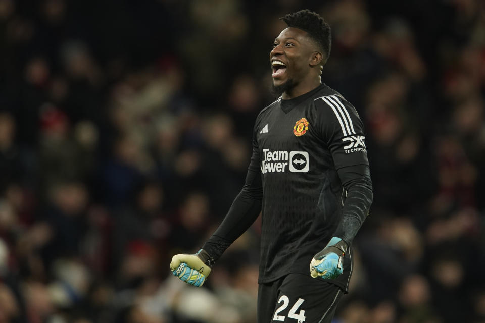Manchester United's goalkeeper Andre Onana celebrates on the full time during the English Premier League soccer match between Manchester United and Aston Villa at the Old Trafford stadium in Manchester, England, Tuesday, Dec. 26, 2023. Manchester United won 3-2. (AP Photo/Dave Thompson)