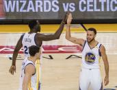 May 14, 2017; Oakland, CA, USA; Golden State Warriors forward Draymond Green (23) high fives guard Stephen Curry (30) after a basket against the San Antonio Spurs during the fourth quarter in game one of the Western conference finals of the 2017 NBA Playoffs at Oracle Arena. Mandatory Credit: Kelley L Cox-USA TODAY Sports