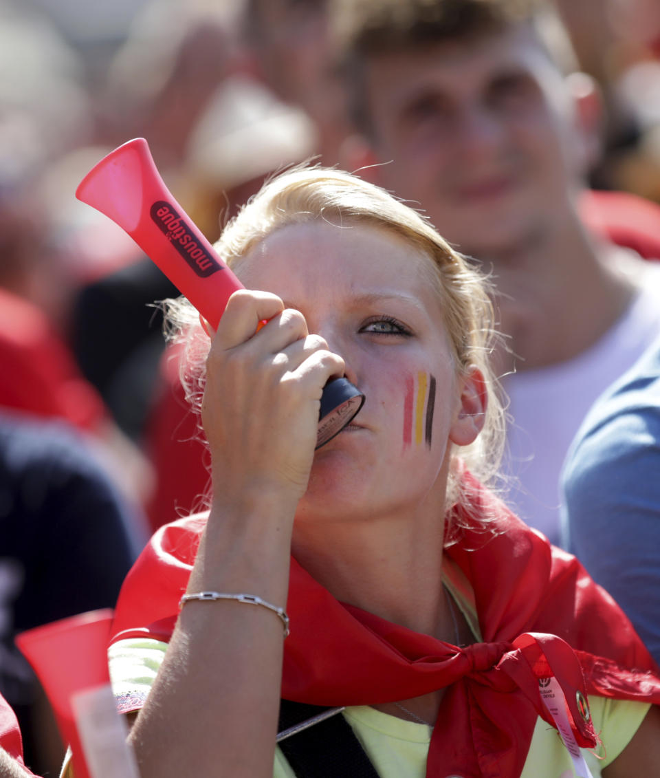 <p>Belgium soccer fans watch a 2018 World Cup soccer match between Belgium and England on a giant screen in Jette, Belgium, Saturday, July 14, 2018. The match will determine third and fourth place. (AP Photo/Olivier Matthys) </p>