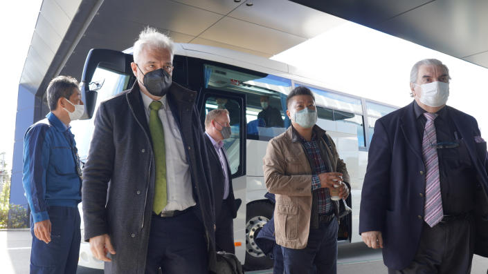 Gustavo Caruso, director of IAEA Department of Nuclear Safety and Security who heads the taskforce, second from left, arrives the Fukushima Daiichi nuclear plant in Okuma, Fukushima prefecture, on Nov. 16, 2022. The head of an International Atomic Energy Agency taskforce reviewing Japan's planned release into sea of treated radioactive wastewater stored at the tsunami-wrecked Fukushima nuclear plant said Friday his team's mission is to show independent views, not to support Tokyo's position.(TEPCO via AP)