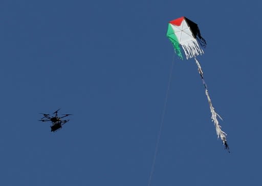 An Israeli drone flies near a Palestinian fire kite on the border between Israel and the Gaza Strip on May 14, 2018 as the army struggles to tackle the low-tech tactic