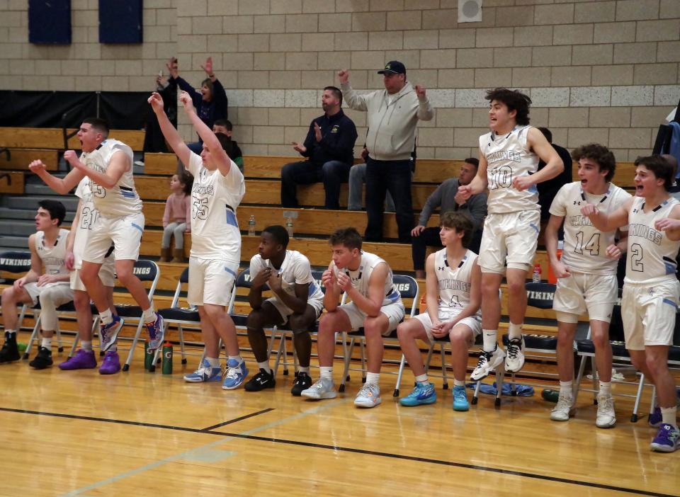 East Bridgewater jumps for joy after beating the Westport Wildcats in a 58-57 thriller on Wednesday, Feb. 22, 2023, which secured a spot in the playoffs for the Vikings.