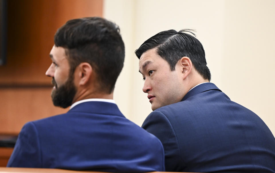 Defendants Christopher "Shane" Burbank, left, and Timothy Rankine sit in the gallery during the pre-trail motion in the trial of Tacoma Police Officers Christopher Burbank, Matthew Collins and Timothy Rankine in the killing of Manny Ellis at Pierce County Superior Court Monday, Sept. 18, 2023, Tacoma, Wash. (Brian Hayes/The News Tribune via AP, Pool)