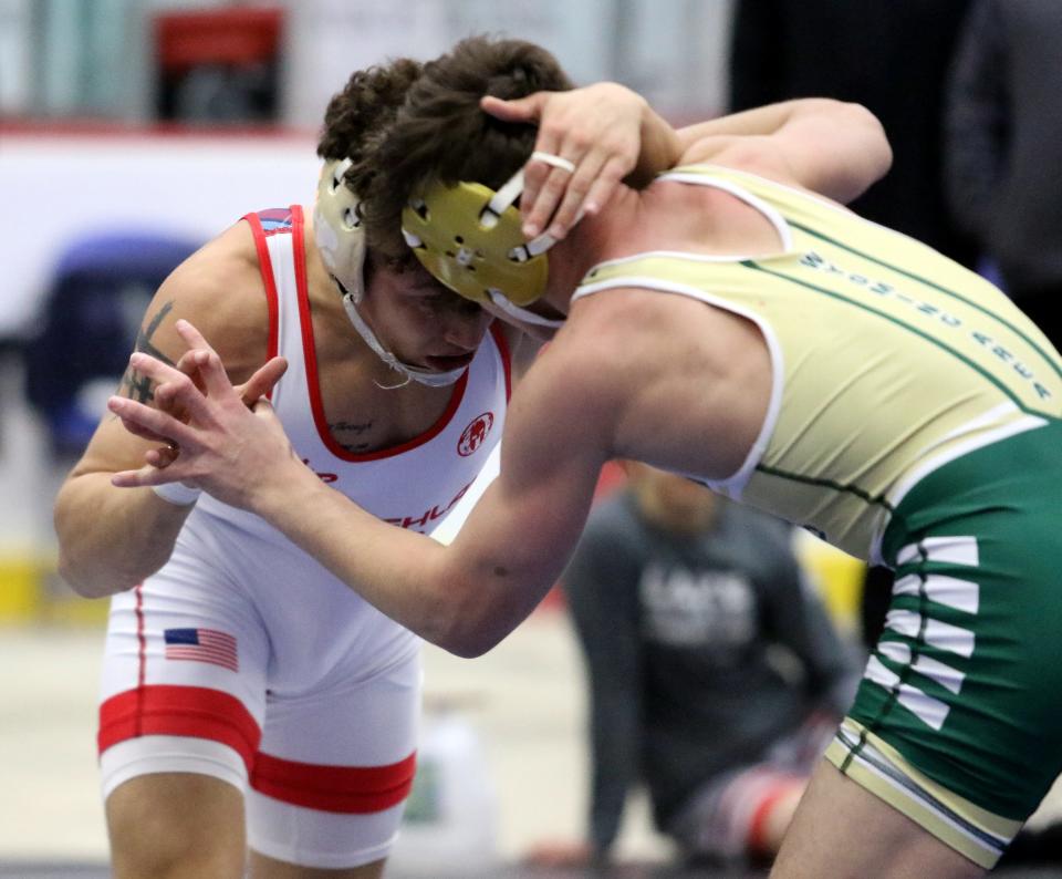 Lake Highland Prep's Eligh Rivera, left, was a 3-1 winner over Wyoming Area's Jaden Pepe in the 138-pound final to earn Most Outstanding Wrestler for boys competitors as Elmira's First Arena hosted the Southern Tier Classic wrestling tournament Jan. 14, 2022.