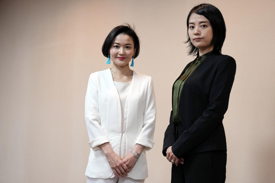 Prosecutors Tomoko Suzuki, left, and Rina Ito pose for photographer during an interview at Tokyo District Public Prosecutors Office Monday, Feb. 27, 2023, in Tokyo. Twenty years ago, only about 8% of Japanese prosecutors were women. By 2018, that number rose to nearly a third of newly hired prosecutors. This year, the male-female ratio reached 50-50, according to the Tokyo District Prosecutors Office. (AP Photo/Eugene Hoshiko)