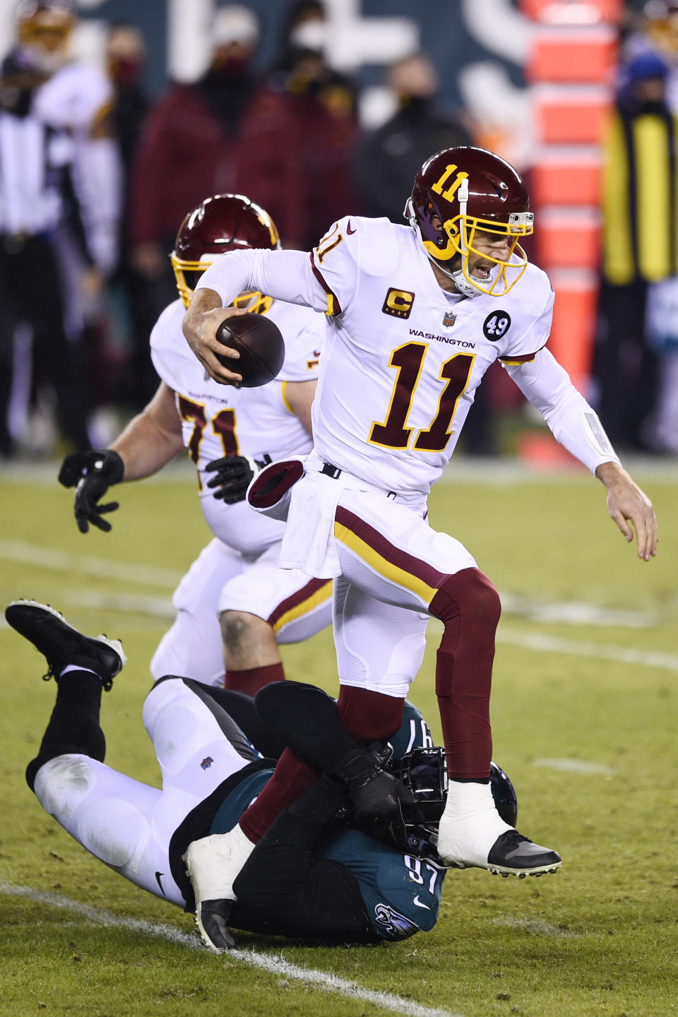 Washington Football Team's Alex Smith (11) is tackled by Philadelphia Eagles' Malik Jackson (97) during the second half of an NFL football game, Sunday, Jan. 3, 2021, in Philadelphia. (AP Photo/Derik Hamilton)