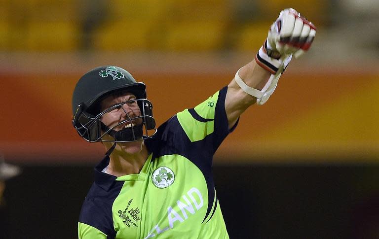 Ireland's George Dockrell celebrates after scoring the winning runs during the Cricket World Cup match against UAE in Brisbane on February 25, 2015