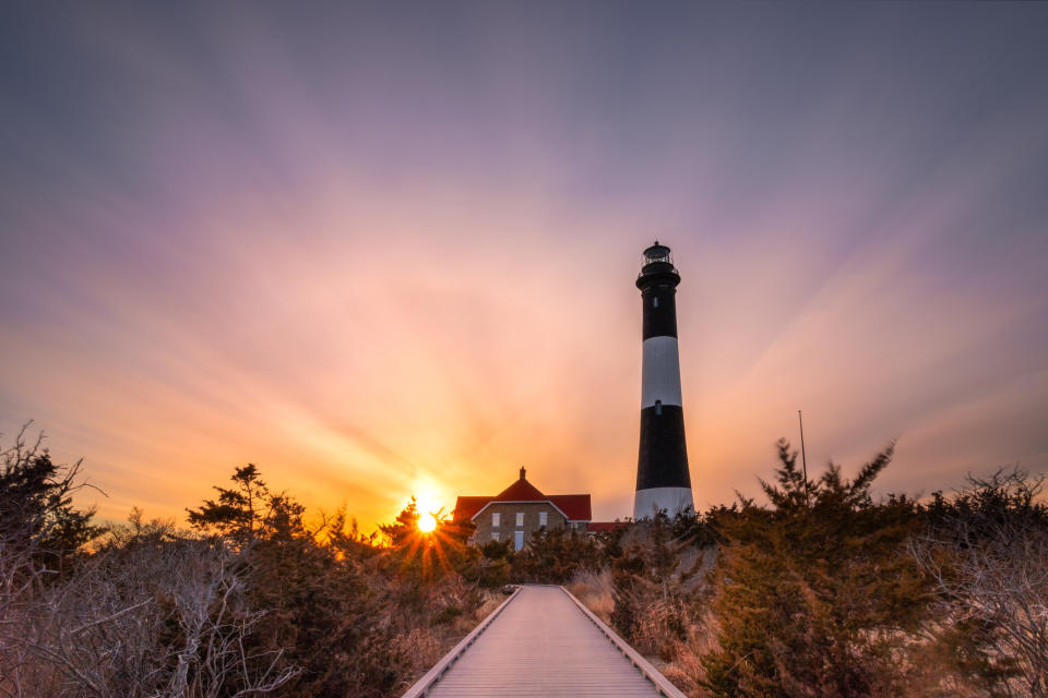A lighthouse at sunset on Fire Island