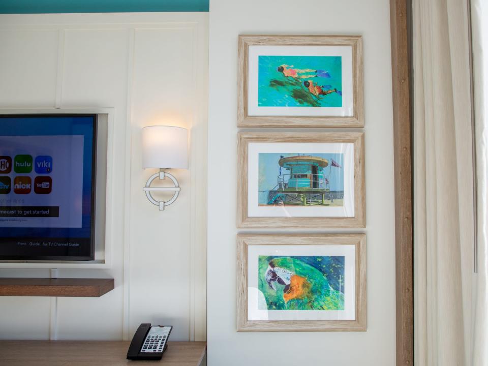 three panels of wall art with beach and tropical themes