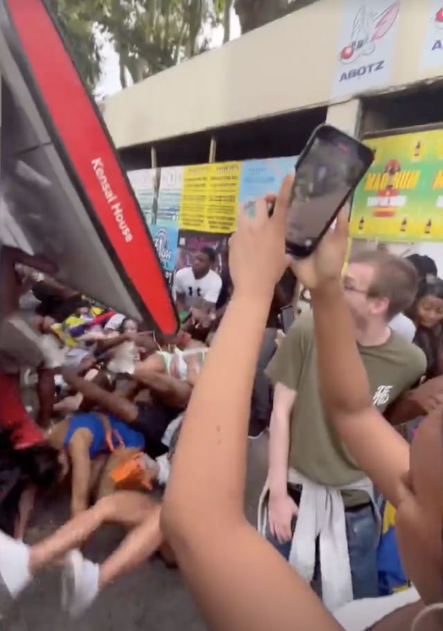 Shocking moment Notting Hill Carnival revellers destroy bus stop after  dancing on top