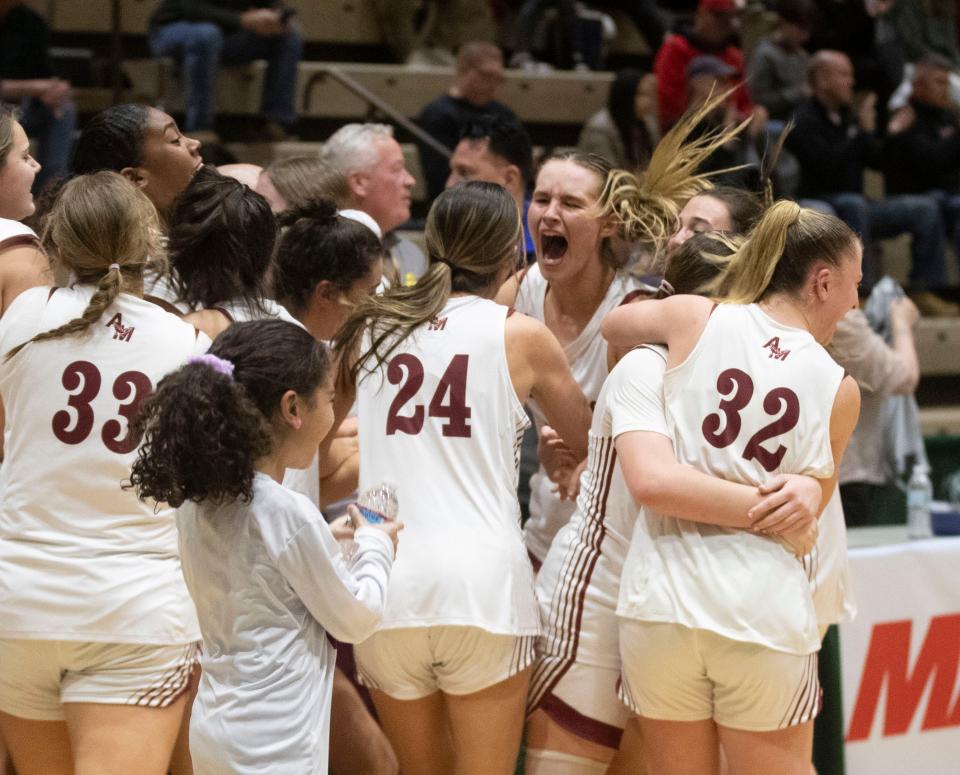 Albertus Magnus celebrates after defeating Hilton 67-50 in the New York State girls Class AA basketball championship at Hudson Valley Community College in Troy March 16, 2024.