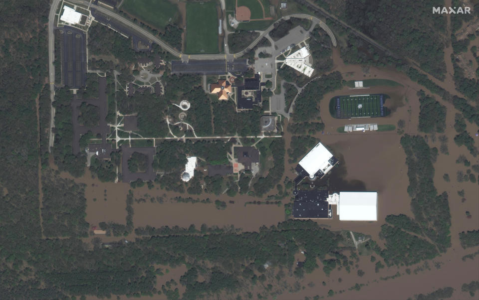 This photo provided by Maxar Technologies shows Northwood University surrounded by floodwaters in Midland, Mich., Wednesday, May 20, 2020. (Maxar Technologies via AP)
