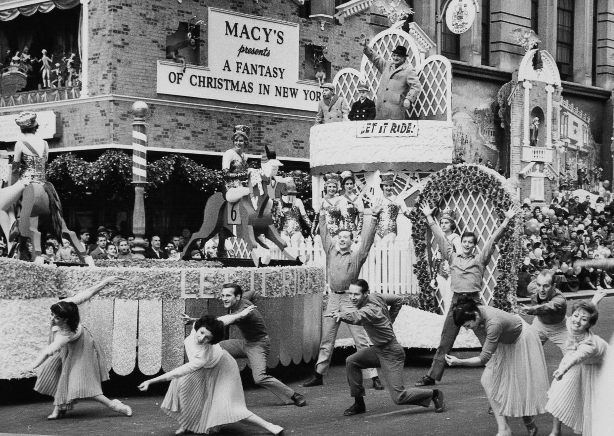 A parade float advertising the Broadway musical "Let It Ride"