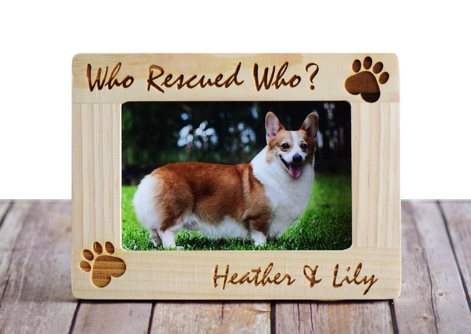 Find this "Who Rescued Who?" personalized frame for $19&nbsp;(currently on sale for $13) on <a href="https://fave.co/2XEdgQc" target="_blank" rel="noopener noreferrer">Etsy</a>.