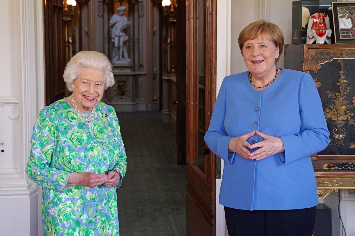 Britain's Queen Elizabeth II receives German Chancellor Angela Merkel during an audience at Windsor Castle in Windsor, Berkshire on July 2, 2021. - German leader Angela Merkel will have a new a science prize established in her honour during a farewell visit to Britain on Friday, which will also include a meeting with Queen Elizabeth II. (Photo by Steve Parsons / POOL / AFP) (Photo by STEVE PARSONS/POOL/AFP via Getty Images)