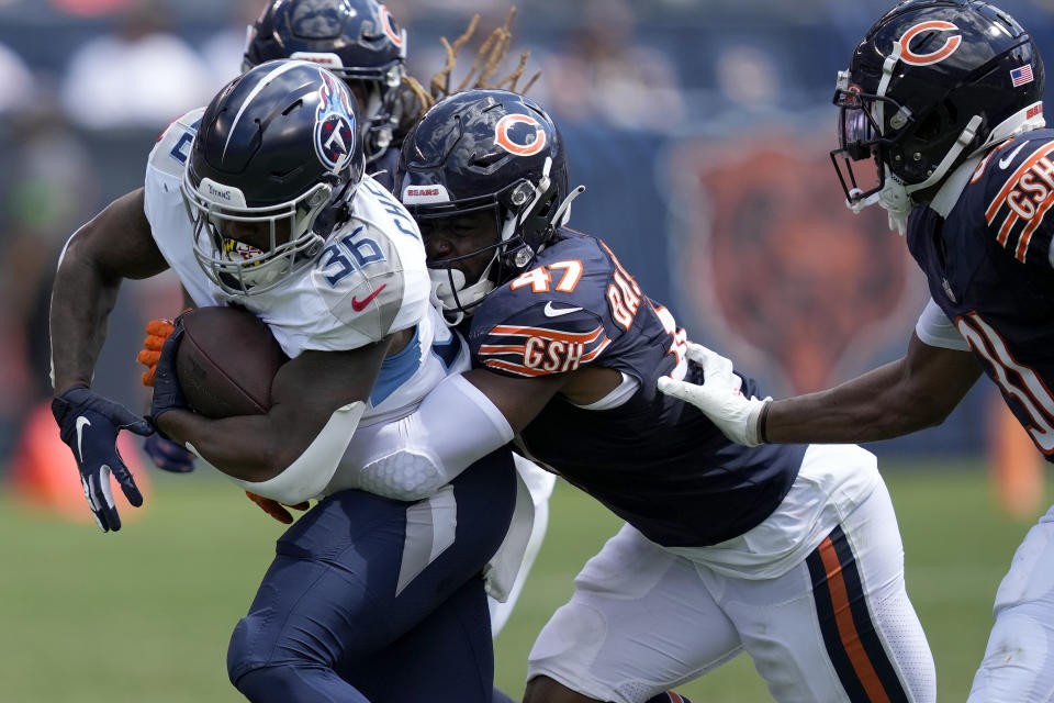 Tennessee Titans running back Julius Chestnut (36) is hit by Chicago Bears linebacker Micah Baskerville during the second half of an NFL preseason football game, Saturday, Aug. 12, 2023, in Chicago. (AP Photo/Charles Rex Arbogast)