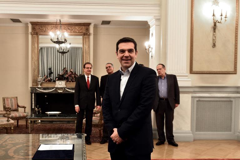Syriza's leader Alexis Tsipras poses for a photograph as he is sworn in as Greek Prime Minister at the Presidential Palace in Athens on January 26, 2015