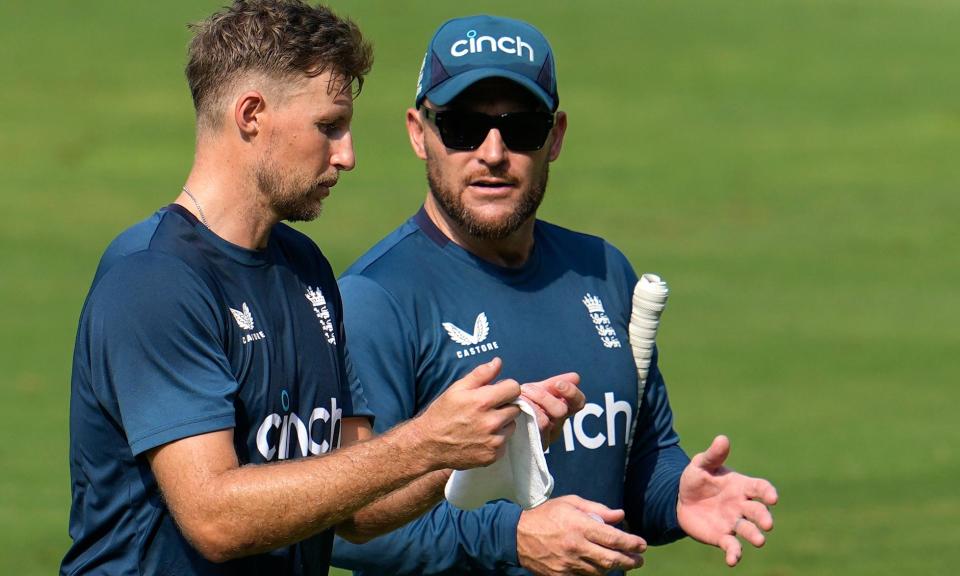 <span>Joe Root talks with the <a class="link " href="https://sports.yahoo.com/soccer/teams/england/" data-i13n="sec:content-canvas;subsec:anchor_text;elm:context_link" data-ylk="slk:England;sec:content-canvas;subsec:anchor_text;elm:context_link;itc:0">England</a> head coach, Brendon McCullum, during a practice session in Visakhapatnam.</span><span>Photograph: Manish Swarup/AP</span>