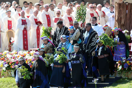 Indigenous Mapuche people take part in a mass led by Pope Francis at the Maquehue Temuco Air Force Base in Temuco, Chile, January 17, 2018. REUTERS/Edgard Garrido