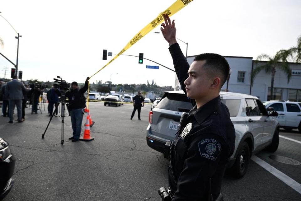 Police let investigators onto the scene of a mass shooting in Monterey Park, Calif., on Jan. 22, 2023.<span class="copyright">Robyn Beck—AFP /Getty Images</span>