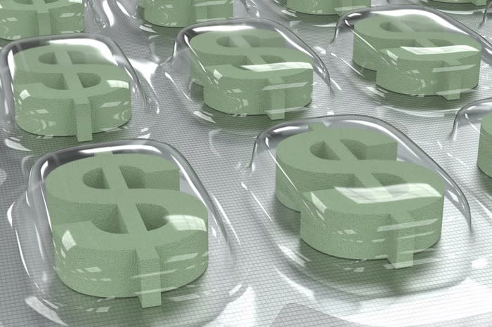 Pills shaped as dollar signs in pill packaging