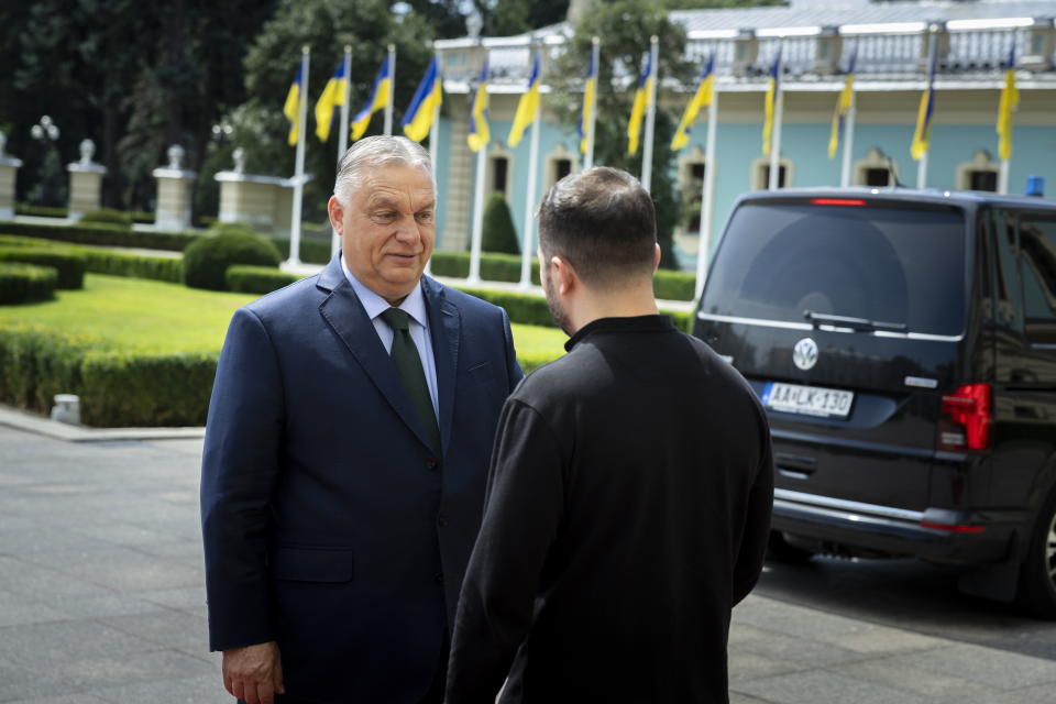 In this photo issued by the Hungarian PM's Press Office, Ukrainian President Volodymyr Zelenskyy, right, welcomes Hungarian Prime Minister Viktor Orban in Kyiv, Ukraine, Tuesday, July 2, 2024. (Zoltan Fischer/Hungarian PM's Press Office/MTI via AP)