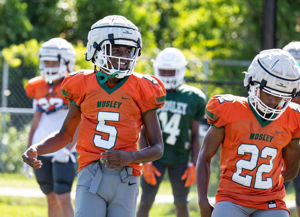 Dolphin Cameron Keys works out with the defense during practice. Mosley football hit the practice field for spring drills Thursday, May 6, 2022.