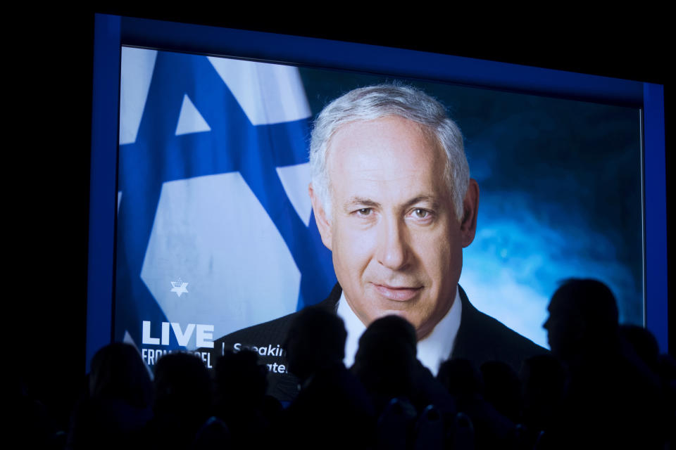 Benjamin Netanyahu, Israel's prime minister, is displayed on a screen while speaking from a satellite location during the AIPAC policy conference in Washington, D.C., U.S., on Tuesday, March 26, 2019. The pro-Israel lobbying groups three-day meeting in Washington kicked off Sunday and features speeches from Vice President Mike Pence, Secretary of State Michael Pompeo, and the Democratic and Republican leaders of the House and Senate, as well as Israeli officials. Photographer: Andrew Harrer/Bloomberg via Getty Images