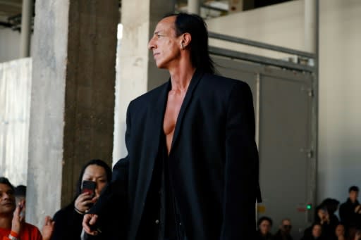 US fashion designer Rick Owens wearing one of his own "Modulor Man" coats at his Paris men's fashion week show