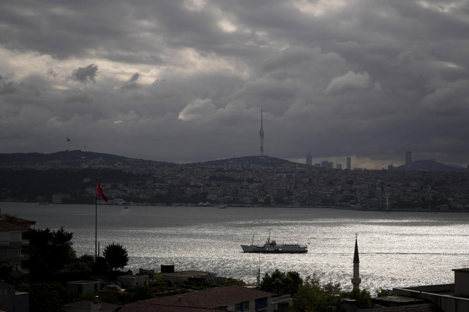 A ferry crosses the Bosphorus in a cloudy morning a day after heavy rains in Istanbul, Turkey, Wednesday, Sept. 6, 2023. In Istanbul, Turkey's largest city, heavy rain flooded streets and homes in two neighborhoods, leaving at least two dead, according to a statement from the governor's office. (AP Photo/Francisco Seco)