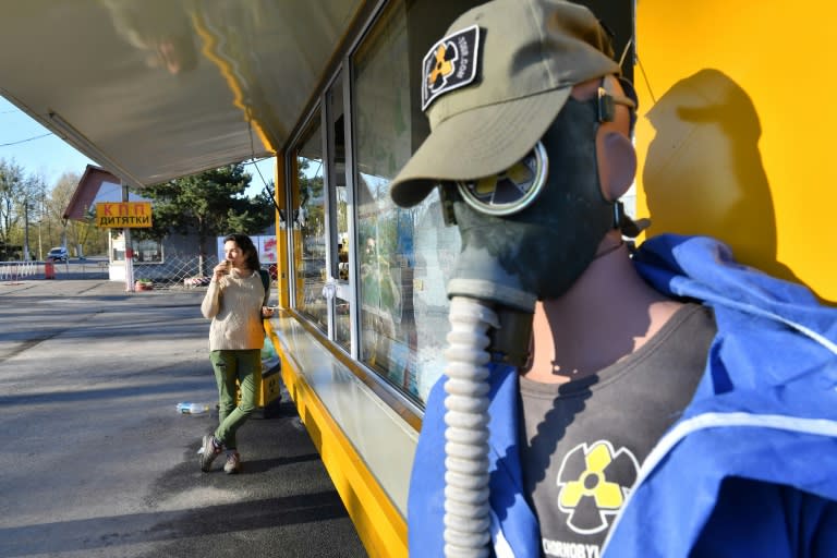 A souvenir kiosk at the main entrance to the exclusion zone sells T-shirts and fridge magnets with the black-and-yellow radiation warning symbol as well as Soviet-era gas masks