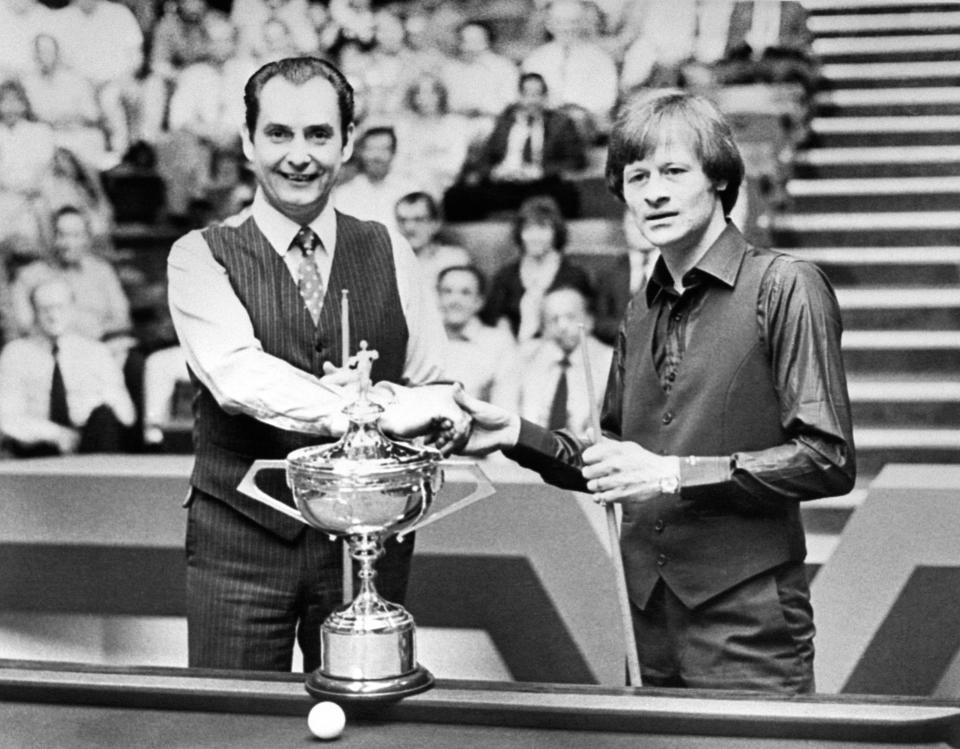 At the Crucible Theatre, Sheffield, Ray Reardon (left) and Alex Higgins, with the Embassy World Championship Cup before the two-day 35 frame snooker final.   (Photo by PA Images via Getty Images)