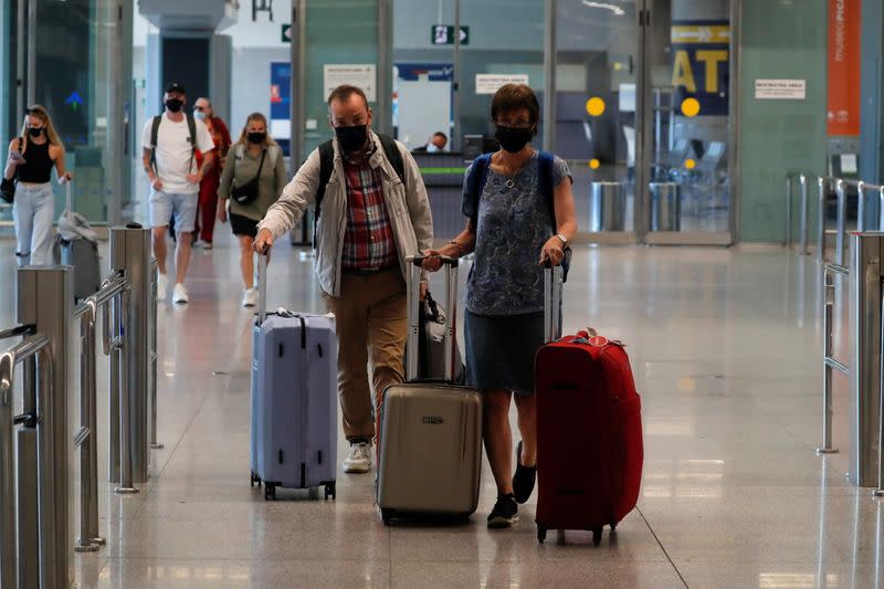 Tourists arrive at Malaga-Costa del Sol Airport, in Malaga