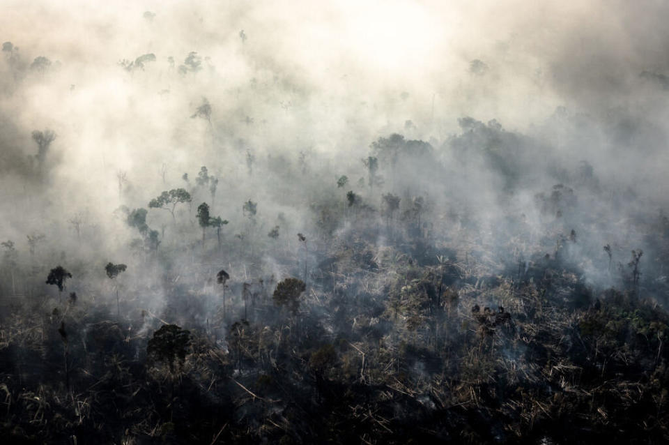 Smoke rises as a fires burn in the Amazon rainforest in this aerial photograph taken above the Candeias do Jamari region of Porto Velho, Rondonia state, Brazil, on Saturday, Aug. 24, 2019. (Photo: Leonardo Carrato/Bloomberg/Getty Images)