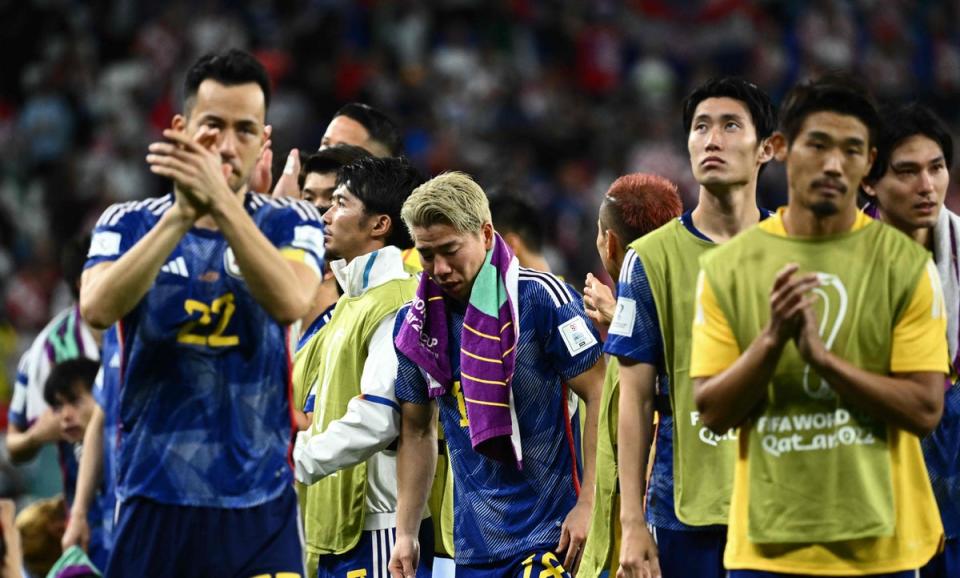 Japan react after losing to Croatia (AFP via Getty Images)